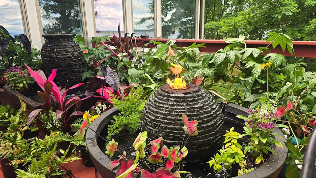 Aquascape fire and water fountain display surrounded by landscape plants at Woody's Nursery in Duluth, GA